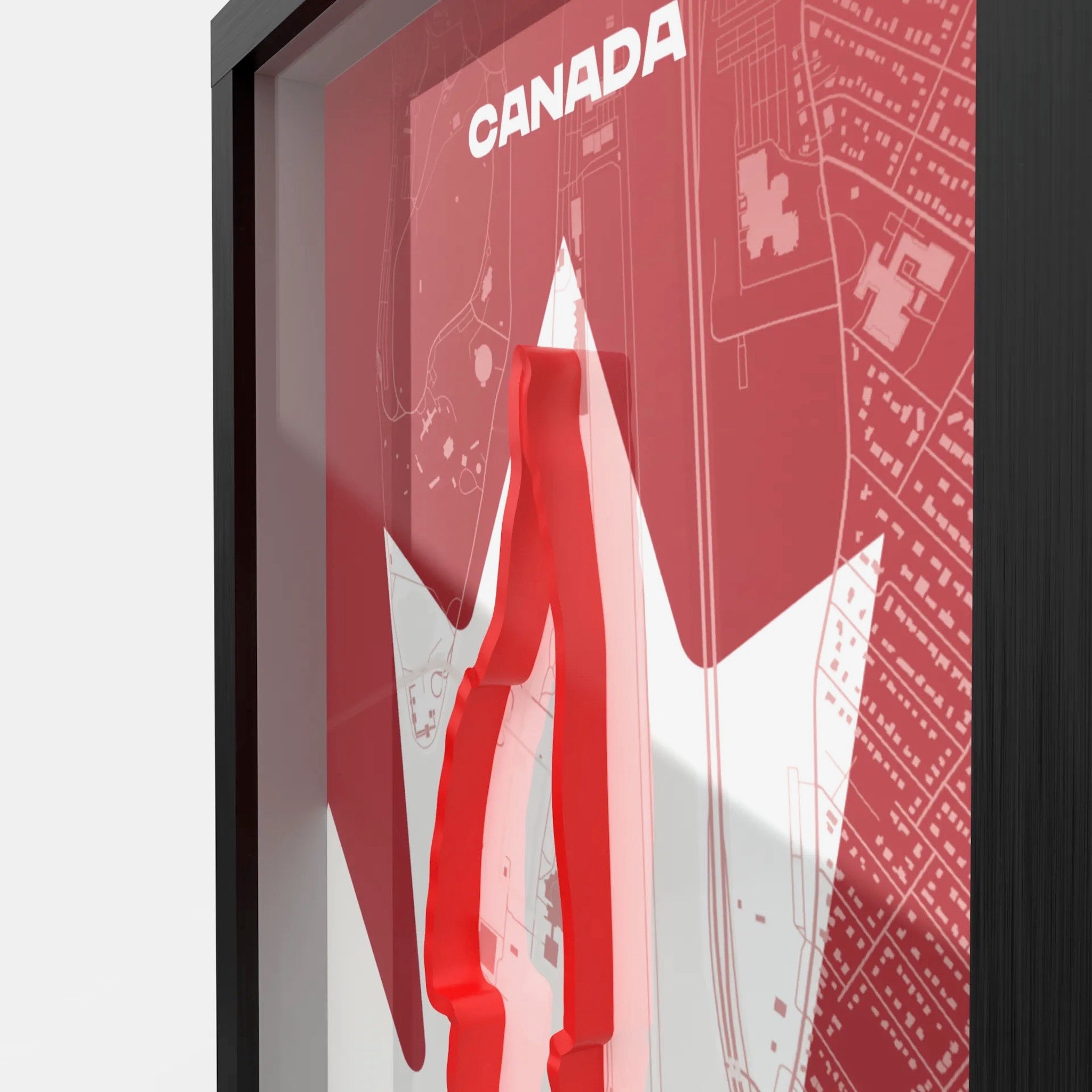 Framed poster with a red and white design featuring the word 'Canada'.