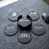 Close-up of Formula 1 team logo coasters set with 3D printed holder on textured surface