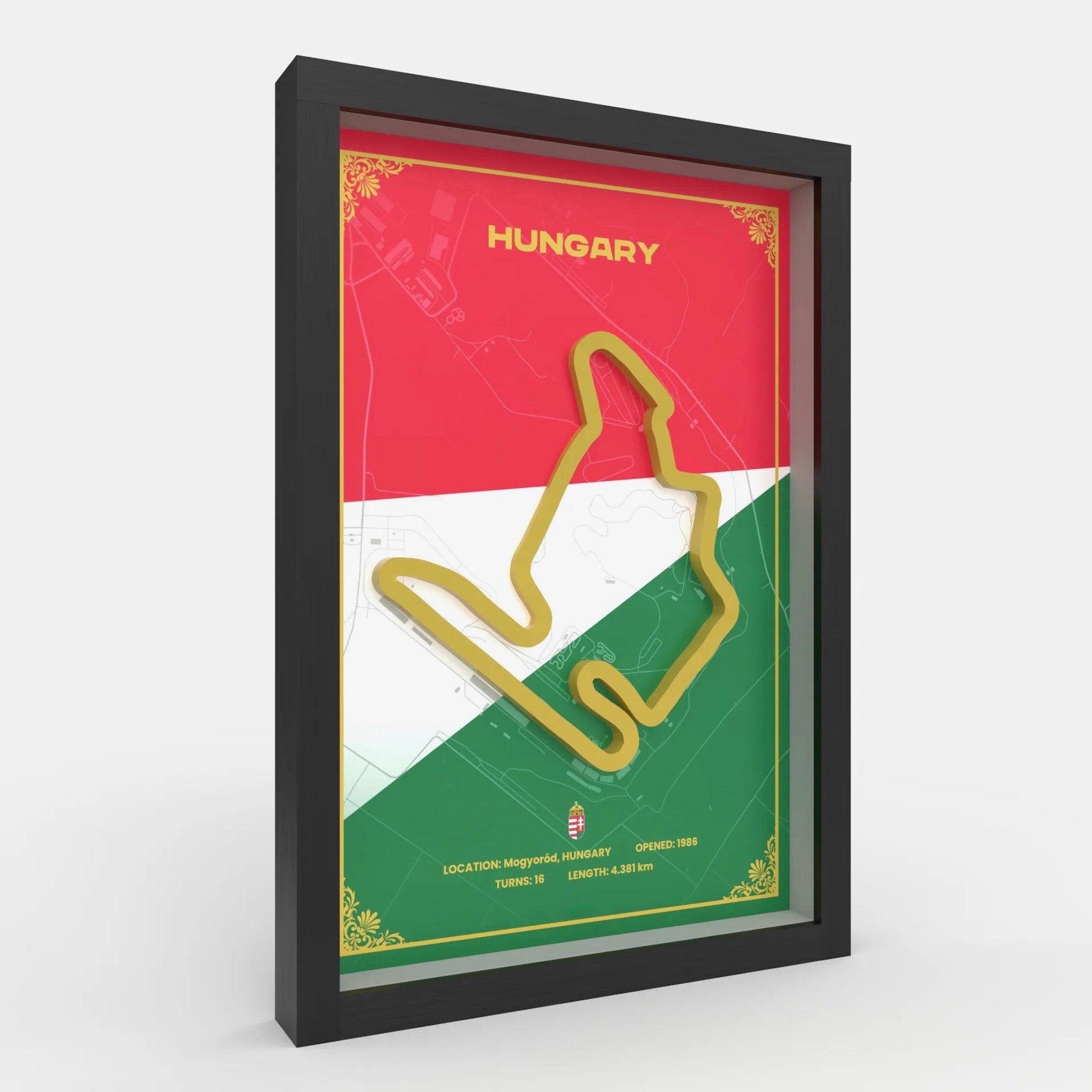 A framed Hungary-themed wall art print featuring the country's flag colors and a gold outline of the Budapest street circuit, shown in a black frame against a light gray background.Detailed Hungaroring track 3D printed layered side view