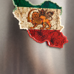 Fridge magnet shaped like a map of iran with a lion emblem on a metallic surface